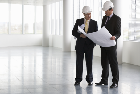 guys looking at plans in hardhats