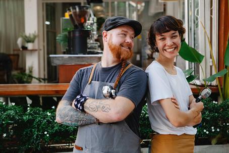 Two people standing together smiling
