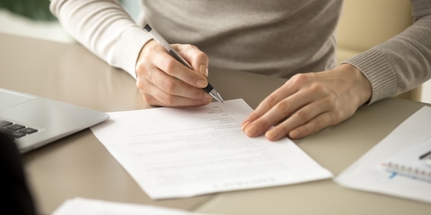 person filling out an application