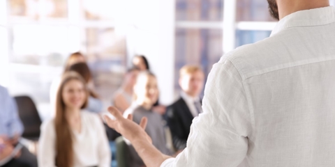 business coach talking to class