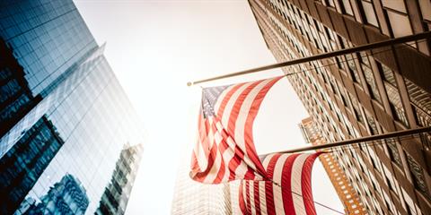 American flag and buildings