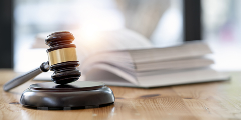 Wooden brown judge gavel on the table, copy space, banner background.