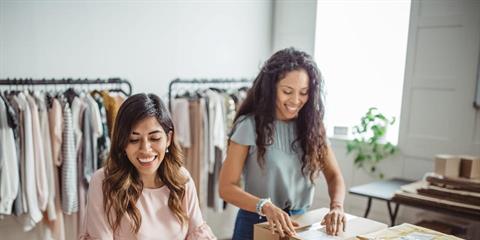 two ladies working a business