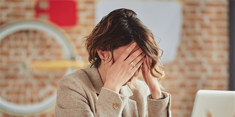 lady with head in hands