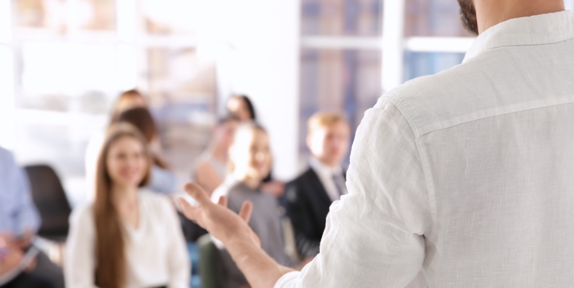 business coach talking to class