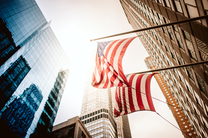 American flag and buildings