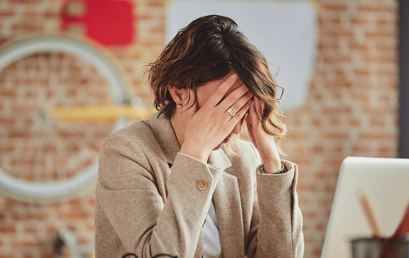lady with head in hands